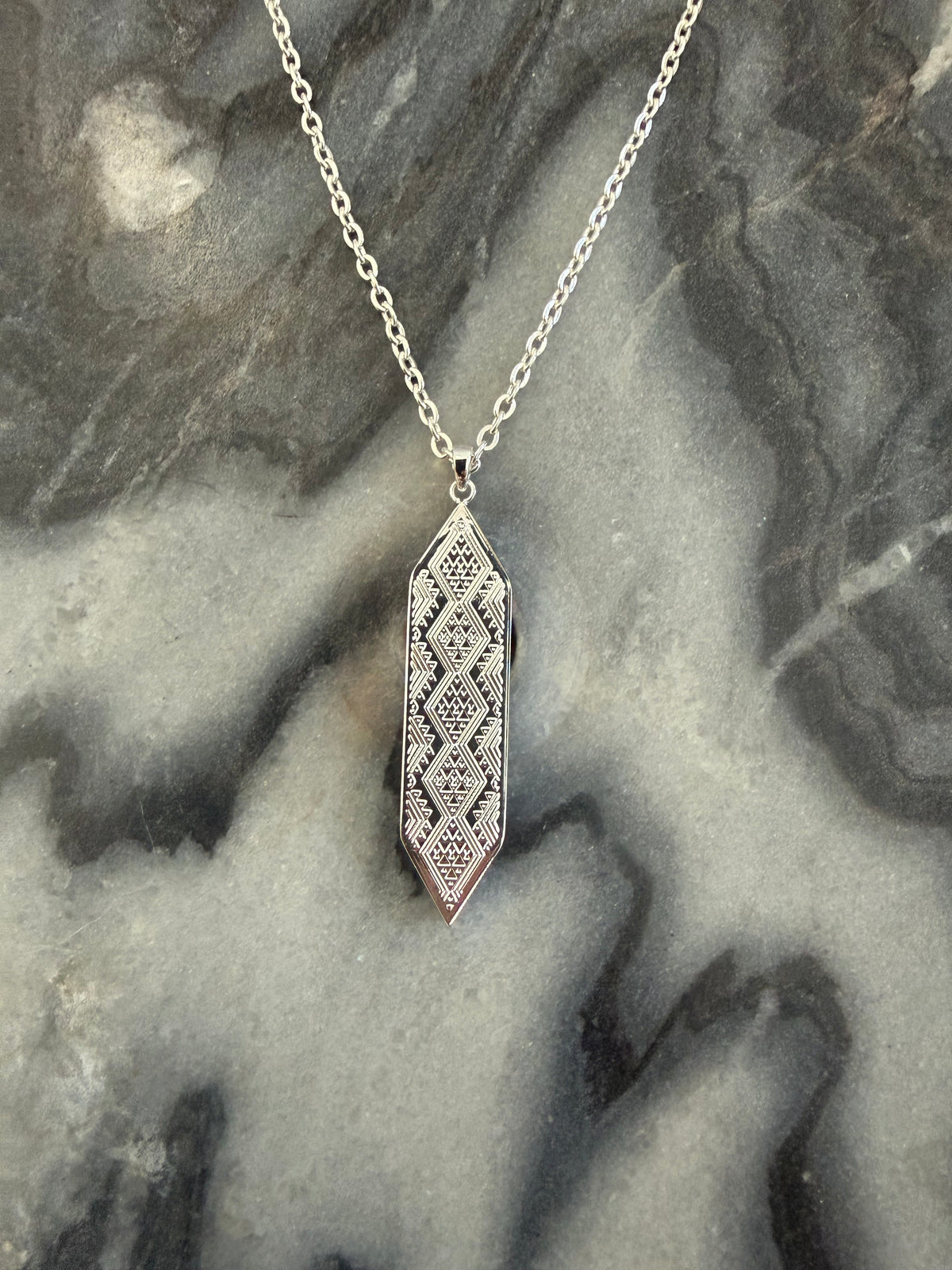 Silver Taniko hou pendant