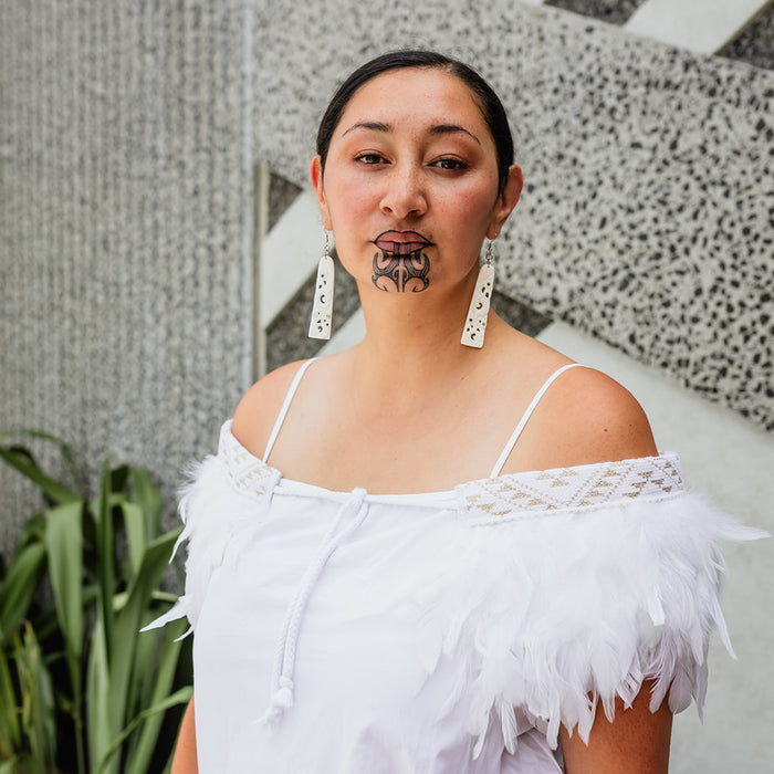 Kākahu Huruhuru - White