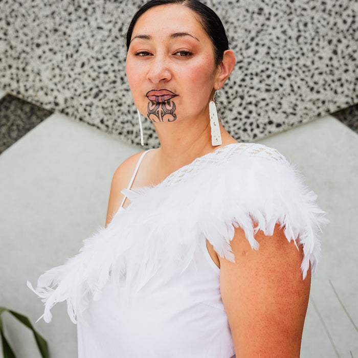 Kākahu Huruhuru - White