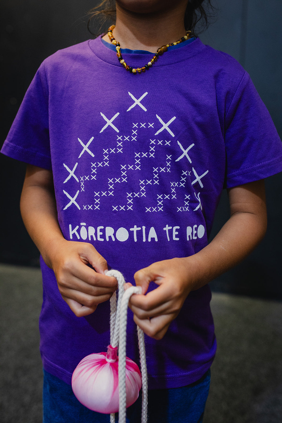 Kainga Korerotia Te Reo Print Child Tee - Purple